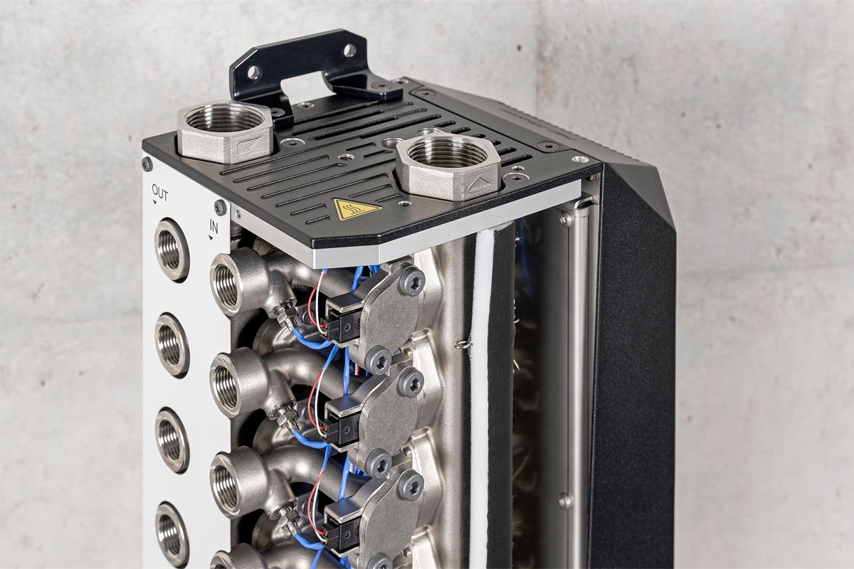 Cut-away of an HB-Therm Flow-6 flow meter showing the ultrasonic measuring channels