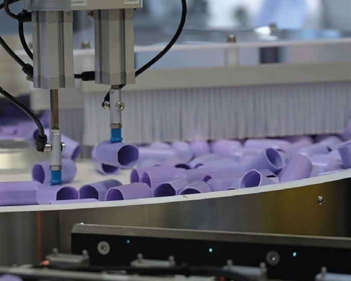 FlexiBowl feeding purple plastic tube fittings